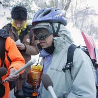 Narrow miss: A climber who was part of a group that was struck by an avalanche Saturday on Mount Shirouma in Nagano Prefecture recounts the experience after reaching the nearby village of Hakuba. | KYODO
