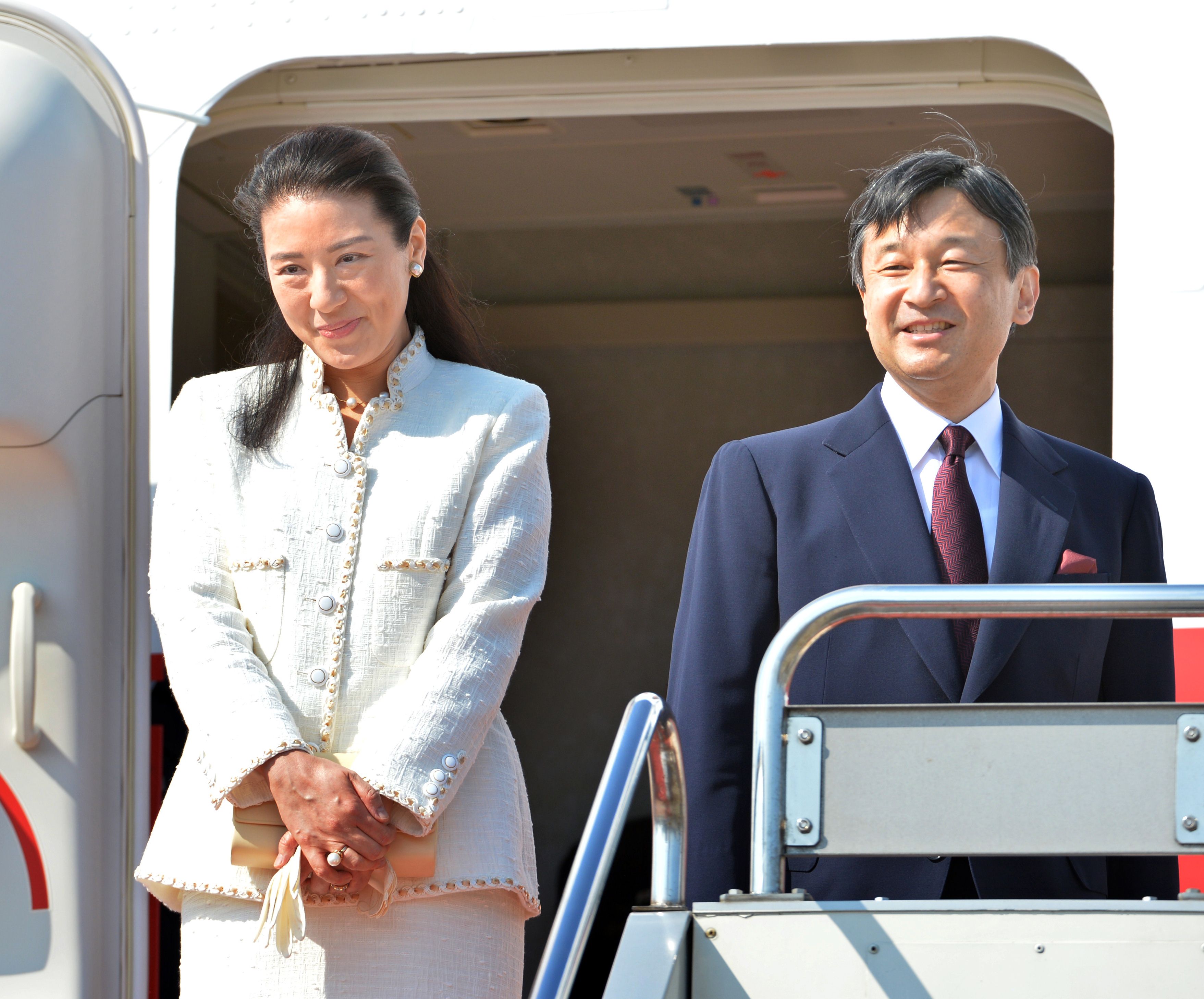 Up and away: Crown Princess Masako and Crown Prince Naruhito acknowledge the crowd before boarding a plane for the Netherlands at Tokyo's Haneda airport on Sunday. The Crown Princess, who has been suffering from a mysterious stress-induced illness for more than a decade, is taking her first official overseas trip in 11 years. | AFP-JIJI