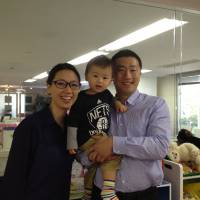 Room to work: Yushi and Minhee Katayama pose with their son, Shota, at their coworking space Hatch in the Akasaka area of Tokyo on April 16. | AYAKO MIE
