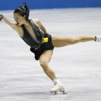 Here to save the day: Akiko Suzuki performs during the women\'s short program at the World Team Trophy on Thursday. | KYODO
