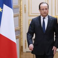 Under fire: French President Francois Hollande arrives at a news conference in Paris on Wednesday. | AP