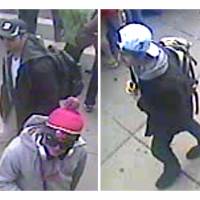 Caught on film: These video stills released Thursday by the FBI show the two Boston bombing suspects, one in a black baseball cap and the other in a white cap, walking along the route of the marathon Monday. Investigators consider the two men to be \"armed and extremely dangerous,\" said Rick DesLauriers, FBI chief in Boston. The bureau has no details yet of the suspects\' identities, origin or motive. | AFP-JIJI