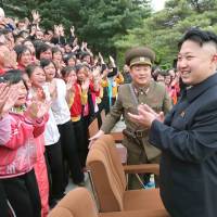 Tears of joy?: Children cry during a visit by North Korean leader Kim Jong Un to Pyongyang Myohyangsan Children\'s Camp in North Phyongan Province on Sunday. | AFP-JIJI