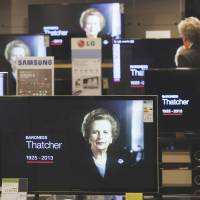 Multiple views on the Iron Lady: A customer watches the news on television screens in a London department store following the death of former U.K. Prime Minister Margaret Thatcher on April 8. Authorized life of Thatcher is clear-eyed, rich in details
