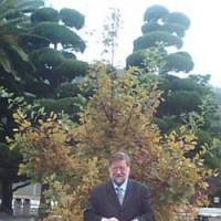 Lasting bond: Yours truly standing, this year, before an English oak I helped ceremonially plant at the MSDF College in Etajima, Hiroshima Prefecture, in 2002. | C.W. NICOL PHOTOS