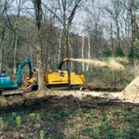 A chipper at work on trimmings in our woods. | C.W. NICOL PHOTO