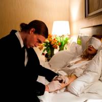 In sickness and in wealth: “Antiviral” protagonist Syd March (Caleb Landry Jones) takes a blood sample from poorly supermodel Hannah Geist (Sarah Gadon), whose fans will pay top dollar to share her illness. Son of Cronenberg debuts with sickly body horror