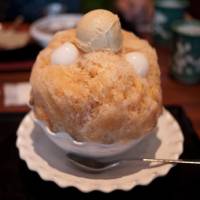 Chilling in the kitchen: A bowl of kakigori (shaved ice) topped with sweet syrup, mochi rice dumplings and ice cream is one of many delicious ways to keep cool this summer. | MAKIKO ITOH
