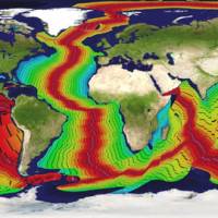 Oceans of data: This map, using radiometric data compiled by the U.S. National Oceanic and Atmospheric Administration, illustrates the process by which the ocean floors have been created within the last 200 million years. Pink and red indicate the most recent additions; greens followed by blues are the oldest. Detail added by researcher Neal Adams\' Continuity Associates breaks the growth into 10-million-year sections. Humans have existed on Earth only during the time indicated by the pink lines. | NOAA / CONTINUITY ASSOCIATES