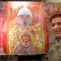 Art on the side: Iranian artist Mansour Kordbacheh poses with his painting \"Oya to Ko\" (\"Parent and Child\") during an interview Jan. 19 at Kamon, his pub in Itabashi Ward, Tokyo. | MARIKO KATO PHOTO