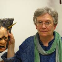 Rebecca Ogamo Teele holds a mask she carved herself for the character of Lady Rakujo, the betrayed wife of Prince Genji in the play \"Aoi no ue.\" | JANE SINGER