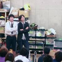 Hot stuff: Comedy duo Parthenon discuss some wacky ways to keep warm in winter, including smearing yourself with chilli sauce, during a recent class at NSC Tokyo. | LUCY BRIDGER