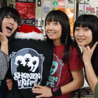 Knife or death: The current members of Shonen Knife (from left: Ritsuko Taneda, Naoko Yamano and Emi Morimoto) show off their gear after a Tokyo gig Dec. 2. | DANIEL ROBSON PHOTO