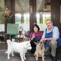 Happy families: Alice (left), her daughter, the writer\'s Rhubarb, and hosts Phil and Akiko Bennett at their friendly Cafe\' Manna. | COURTESY OF RANDY CHANNELL