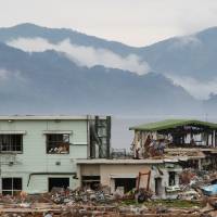 Wave of mutilation: A house near the Iwate Prefecture town of Yamada lies in ruins after March\'s tsunami. | CHRISTOPHER JOHNSON PHOTOS