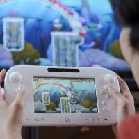 Moving to adapt: Nintendo Co. is trying to modify its Wii U videogame console so smartphone applications can be used on them. | BLOOMBERG
