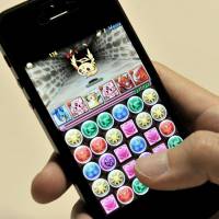 Game on: \"Puzzle and Dragons\" is proving a popular game for smartphones. | YOSHIAKI MIURA