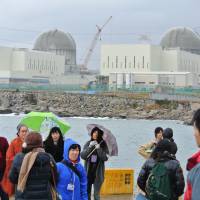Eye-opener: Participants in a bilateral tour aimed at learning about South Korea\'s atomic energy operations visit the Shin Kori plant in Ulsan, which faces the Sea of Japan, on Dec. 2. | ERIKO ARITA