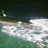 Twilight shot?: A floating pier from Japan drifts off Washington state Friday. | U.S. COAST GUARD / KYODO