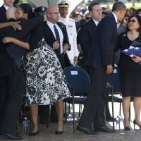Shared loss: U.S. President Barack Obama comforts Irene Hirano Inouye, the widow of Sen. Daniel Inouye, as first lady Michelle Obama embraces Inouye\'s son, Daniel Ken Inouye Jr., during a memorial service for the late senator at the National Memorial Cemetery of the Pacific on Sunday. | AP