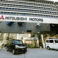 Showtime: Cars are displayed at Mitsubishi Motors Corp. head office in Tokyo\'s Minato Ward on Tuesday. | KYODO