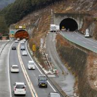 Road narrows: The outbound portion of the Sasago Tunnel in Yamanashi Prefecture opens to two-way traffic Saturday after the ceiling of the Tokyo-bound side collapsed earlier this month. | KYODO