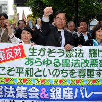 Keeping the faith: Japanese Communist Party chief Kazuo Shii (third from right) and Mizuho Fukushima (fourth from right), who heads the Social Democratic Party, march with other protesters in Tokyo\'s Hibiya district on Friday. | YOSHIAKI MIURA