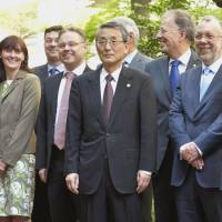 Representatives from nine countries pose for a group photo Monday ahead of meetings of the International Nuclear Regulators Association. | KYODO