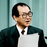 Historic words: Chief Cabinet Secretary Kozo Igarashi speaks at a news conference in Tokyo in June 1994. | KYODO
