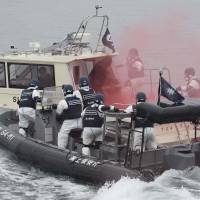 Thinking the unthinkable: Police and the Japan Coast Guard stage a joint drill Saturday against a terrorist attack at the Fukushima No. 2 nuclear plant, practicing countermeasures on both land and sea. | KYODO