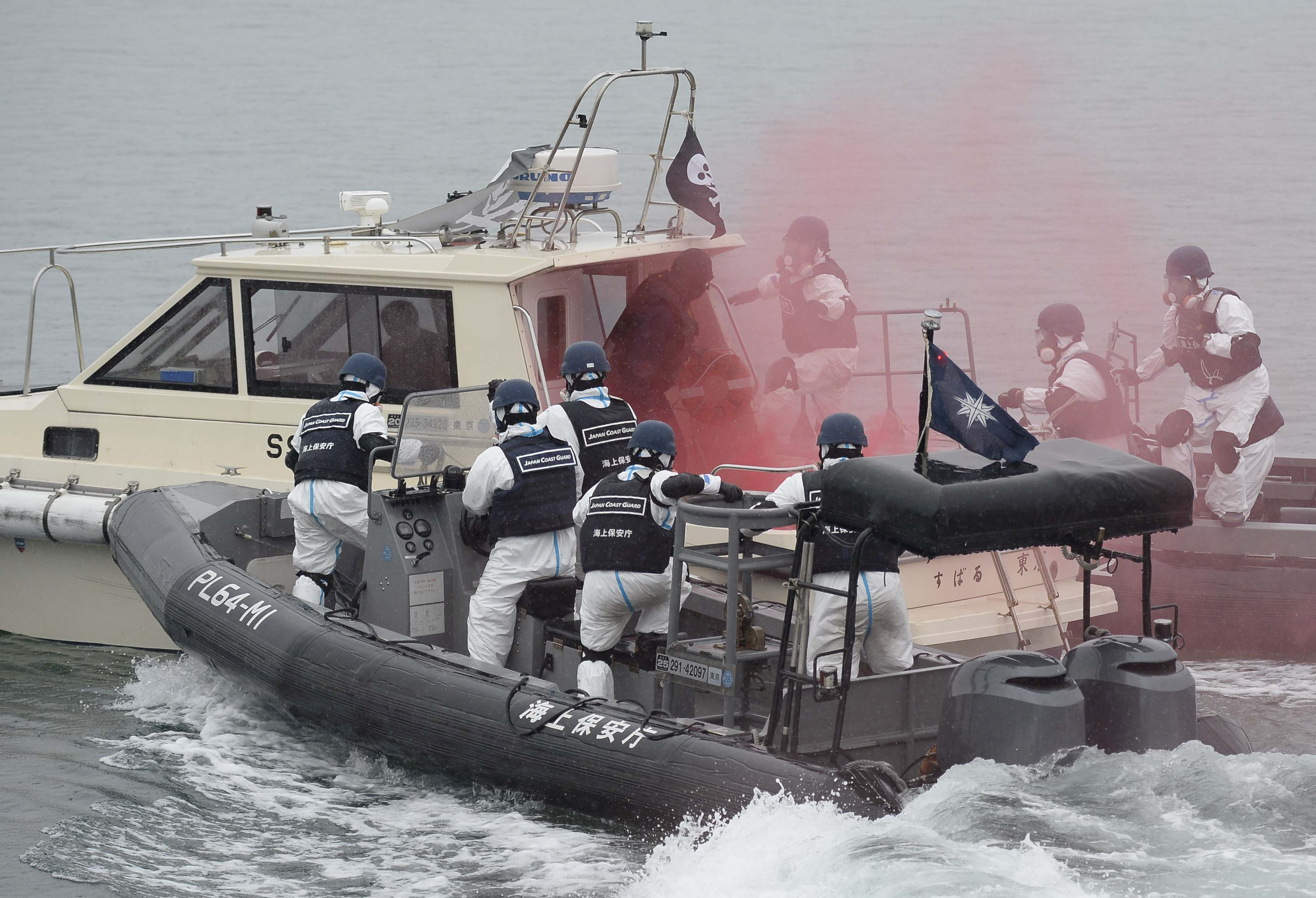 Thinking the unthinkable: Police and the Japan Coast Guard stage a joint drill Saturday against a terrorist attack at the Fukushima No. 2 nuclear plant, practicing countermeasures on both land and sea. | KYODO