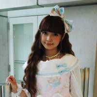 Frilly frock: Misako Aoki, head of the Japan Lolita Association, poses in a Lolita dress in the city of Fukuoka on May 19. | KYODO