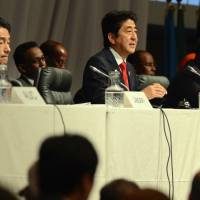 On point: Prime Minister Shinzo Abe speaks at a special session on Somalia during the fifth Tokyo International Conference on Africa Development in Yokohama on Friday as Somalia’s president, Hassan Sheikh Mohamud (right), looks on. Somalia seeks return to global fold