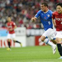 Big change: Defender Ryota Moriwaki (right) moved to Urawa Reds this season following a lengthy career with Sanfrecce Hiroshima where he appeared in 141 matches. | AP