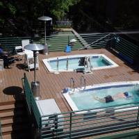 Pampered: One Google employee swims while another one takes in some sun at the Internet giant\'s headquarters in Mountain View, California, on April 25. | AP