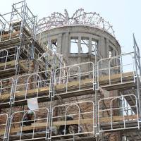 Workers take samples from a wall at the Atomic Bomb Dome in Hiroshima on Tuesday as part of the city\'s checks on the structure\'s resistance to earthquakes. Survey work on the dome, designated as a World Heritage site, will continue until later next month. | KYODO