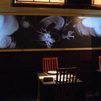 Quest for the best: Powerful dragon motifs adorn the walls and tableware in the lavishly refurbished dining room of Ryugin in Roppongi. | ROBBIE SWINNERTON PHOTOS