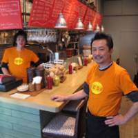 No ordinary burgermeister: At Eat in Gaienmae, chef Michi Takahashi (above) serves much more than just gourmet hamburgers. His side dishes include spicy seafood gumbo (below) and fresh tortilla chips with homemade salsa and creamy guacamole. | AP PHOTO