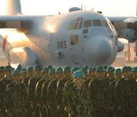 Lines of duty: ASDF members at Komaki, Aichi Prefecture, stand before an aircraft set to take them to Iraq in December 2003. Secrets and lies