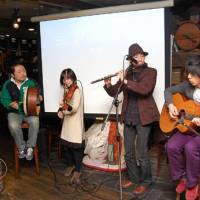 Greening of Tokyo: Members of a band play Irish music at the start of the annual gathering for St. Patrick\'s Day celebrations held by the Japan-Ireland Society in Tokyo on Sunday. | KAZUAKI NAGATA PHOTO
