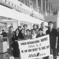 Ray Kruger (second from right) poses with members of a tour group before taking off on the first flight to leave the Kansai International Airport in 1994. | COURTESY OF RAY KRUGER
