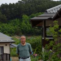 Yoshiichi Ohsawa harvests mushrooms from forests slated for pesticide spraying. | WINIFRED BIRD PHOTO