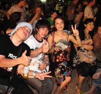 Hot and heartfelt: Molice drummer Takashi Koyama and guitarist Yuzuru Takeda spend time with people in the audience at the CAMA festival in Hanoi. On tour: Molice thunder through Vietnam
