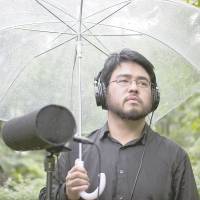 Green mind: Producer Yosi Horikawa stands with a mic in Tokyo\'s Arisugawa Park. The artist\'s electronic compositions often use field recordings. | JAMES HADFIELD