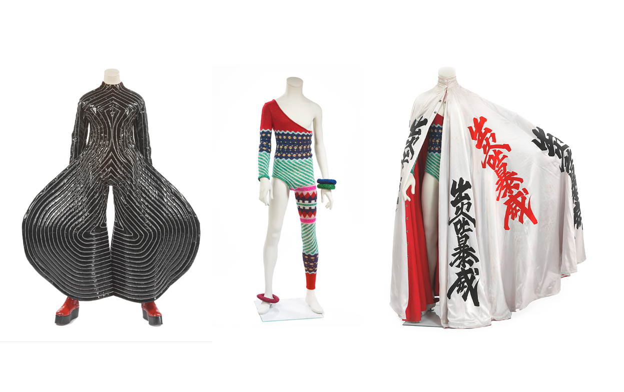 A space oddity: (left to right) 'Tokyo Pop' vinyl bodysuit (1973), designed by Kansai Yamamoto for the Aladdin Sane tour; Asymmetric knitted bodysuit (1973), designed by Kansai Yamamoto for the Aladdin Sane tour; cloak decorated with kanji characters (1973), designed by Kansai Yamamoto for the Aladdin Sane tour. | THE DAVID BOWIE ARCHIVE