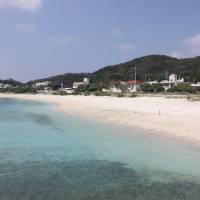 Away from it all: Main Beach on Akajima with the Kawai Diving guest house on the far left. Sand, sea and stars on idyllic Akajima