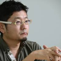 All ads up: Toshiki Oya, chief executive officer of Yahoo Japan Corp., is interviewed Tuesday in Tokyo. Shift to mobile services to up ad growth: Yahoo Japan