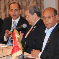 Building bridges:  Tunisian President Moncef Marzouki (right) and  Tunisian Foreign Minister Othman Jerandi (second from right) attend a roundtable meeting with Japanese businesspeople in  Yokohama on Sunday. | SATOKO KAWASAKI