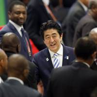 Center of attention: Prime Minister Shinzo Abe greets delegates after the closing session of the fifth Tokyo International Conference on African Development in Yokohama on Monday. Importance of private sector's role featured in Yokohama Declaration
