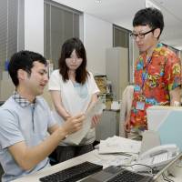 Chilling: Officials work in light clothing Monday at the Environment Ministry as the government\'s Super Cool Biz drive to promote energy conservation kicks off. | KYODO